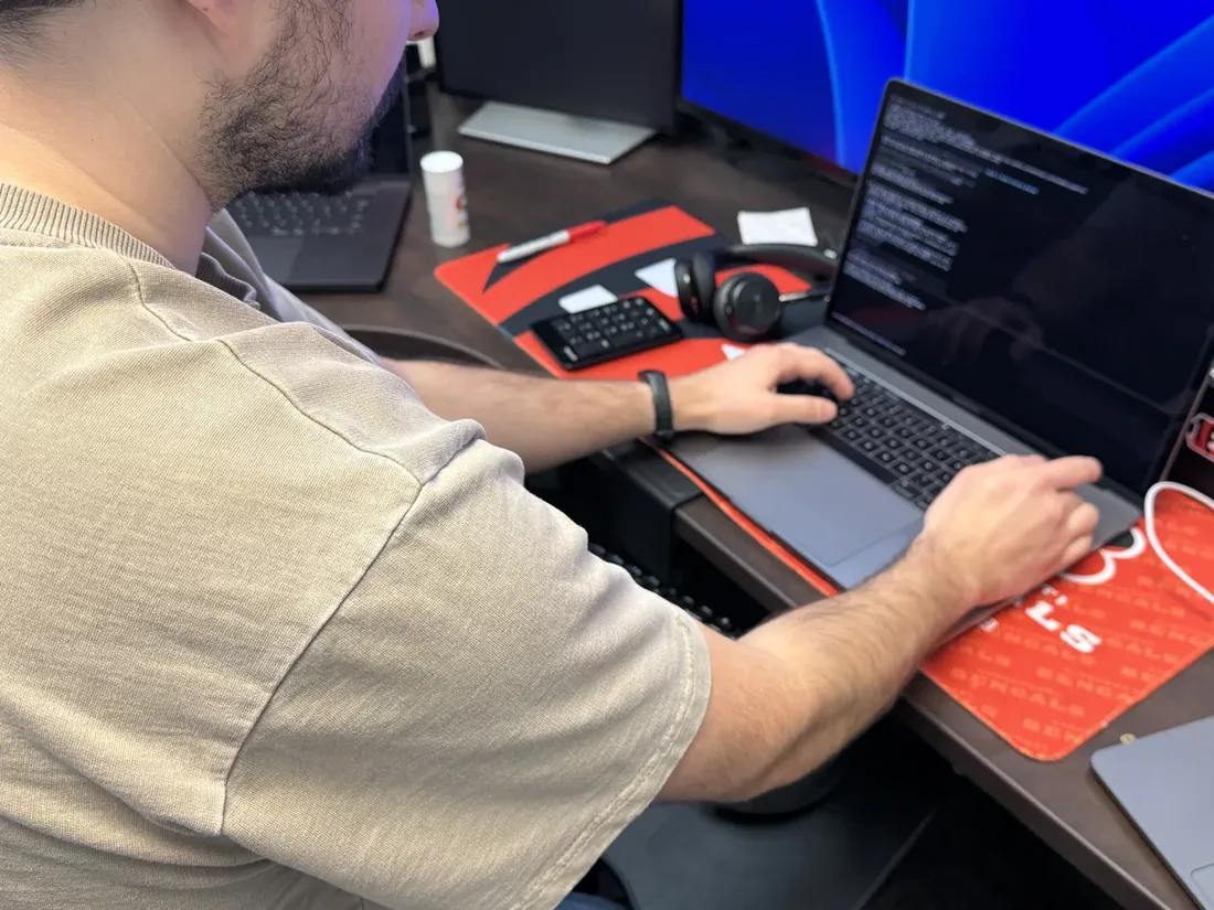 A technician working at a laptop.